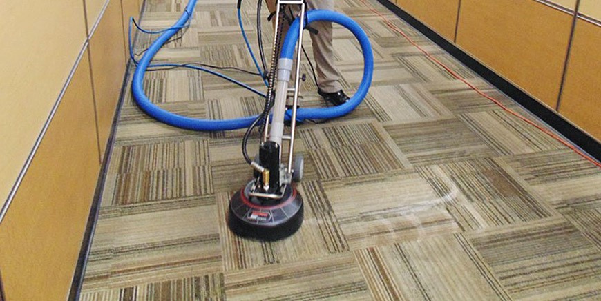 Mechanical cleaning of commercial carpet tiles