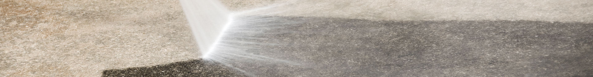 High-pressure water jet cleaning an exterior surface