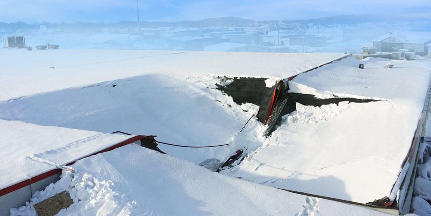 Roof buried under a heavy accumulation of snow