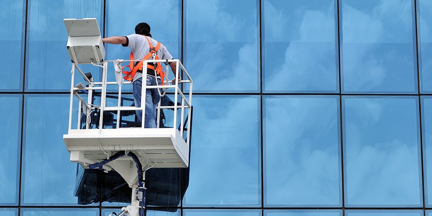 Aerial platform in front of a glass façade